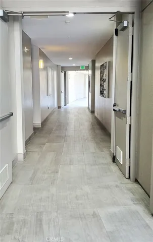 a view of a patio with couches table and chairs and potted plants
