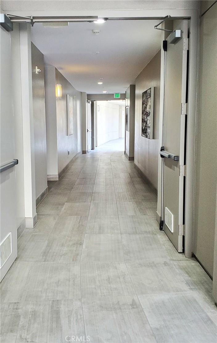 21 Gramercy, Unit 307 Irvine, CA 92612 - Photo 37 of 65 a view of a hallway with closet and a bathroom