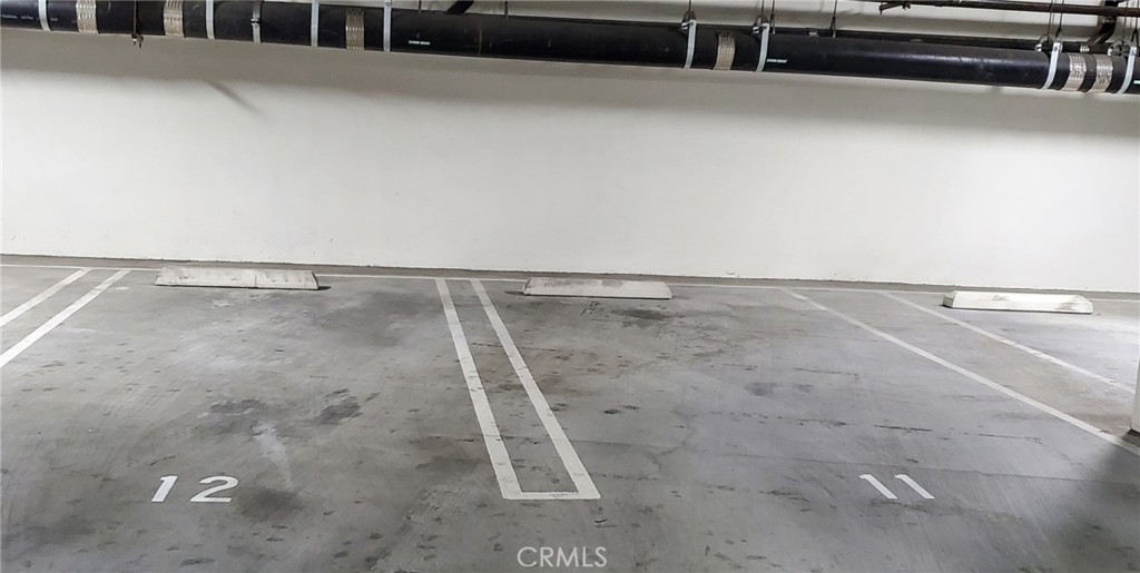 21 Gramercy, Unit 307 Irvine, CA 92612 - Photo 40 of 65 a view of a room with racks on the wall