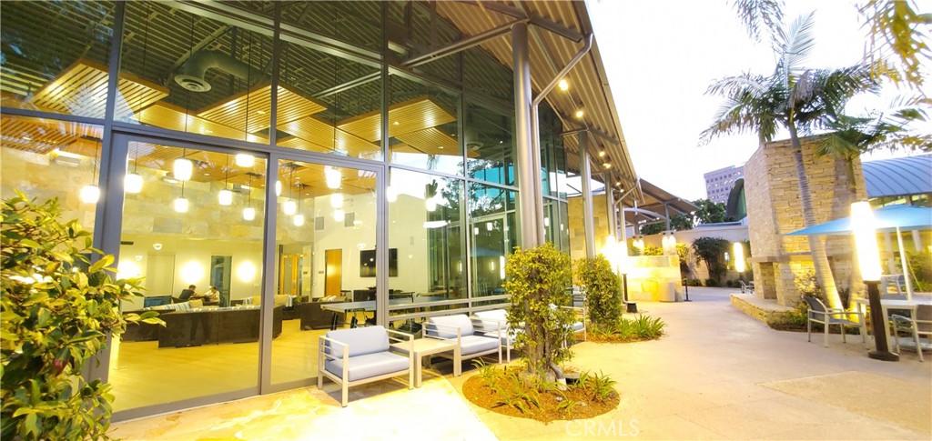 21 Gramercy, Unit 307 Irvine, CA 92612 - Photo 55 of 65 a view of a swimming pool with outdoor seating