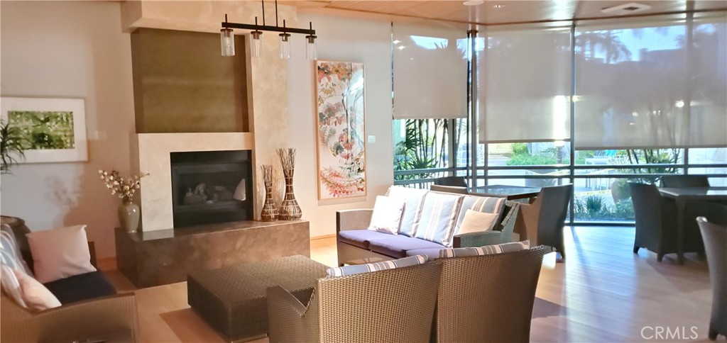 21 Gramercy, Unit 307 Irvine, CA 92612 - Photo 64 of 65 a living room with furniture and a fireplace