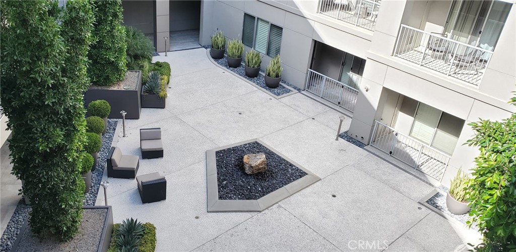 21 Gramercy, Unit 307 Irvine, CA 92612 - Photo 7 of 65 a buildings with trees in front of it