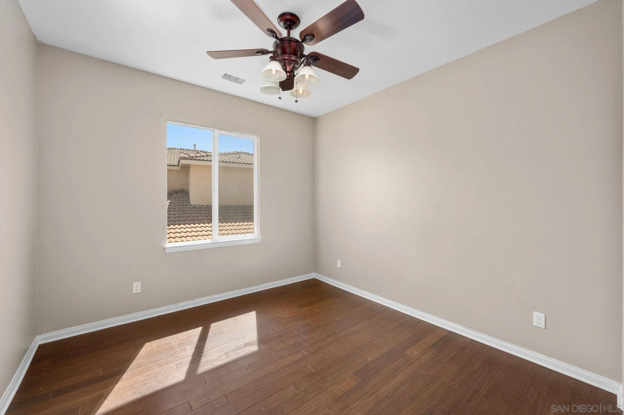 29885 Loy Drive Menifee, CA 92585 - Photo 11 of 75 a view of a big room with wooden floor and a chandelier fan