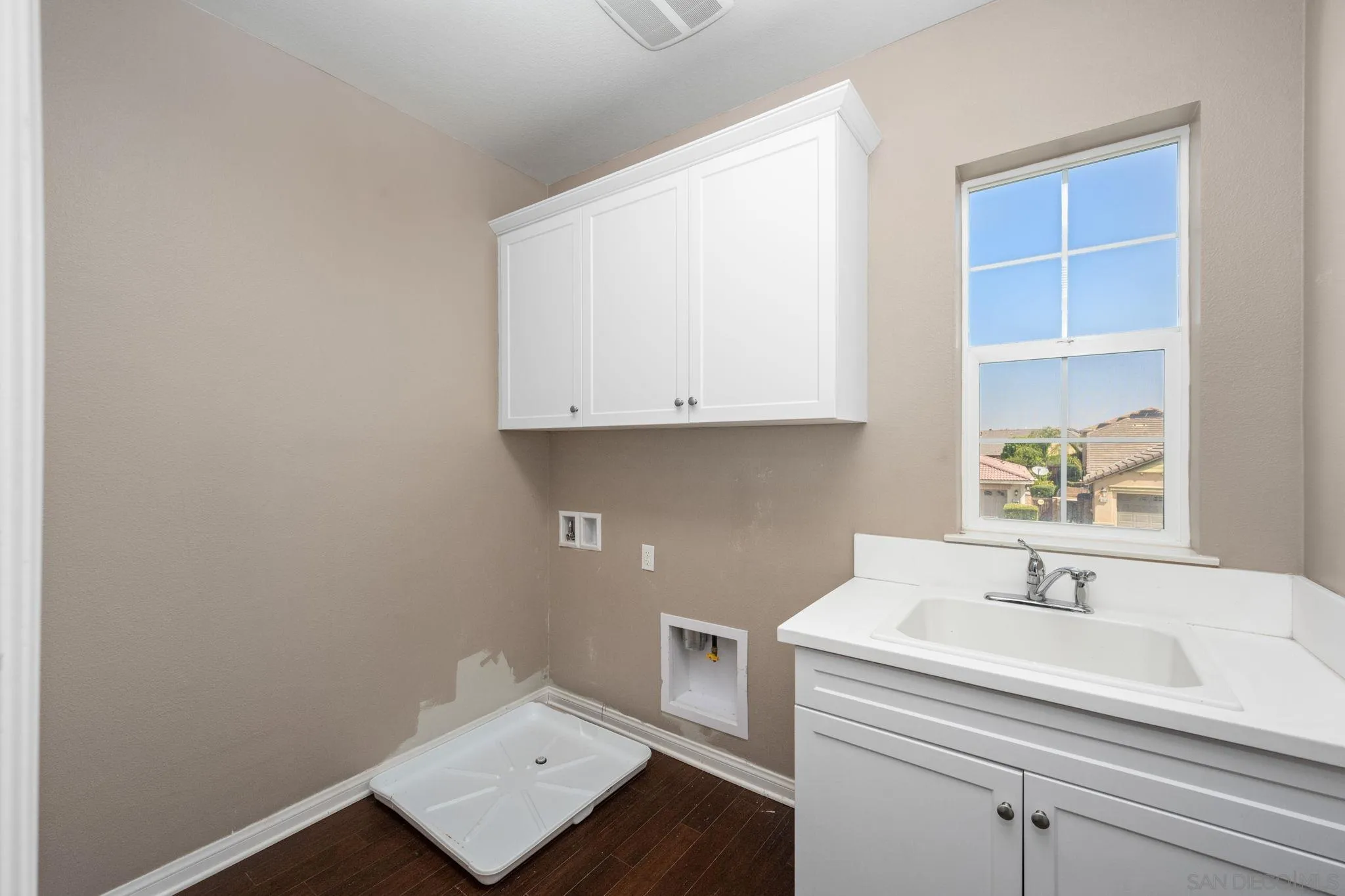 29885 Loy Drive Menifee, CA 92585 - Photo 14 of 75 a bathroom with a sink and a white cabinet