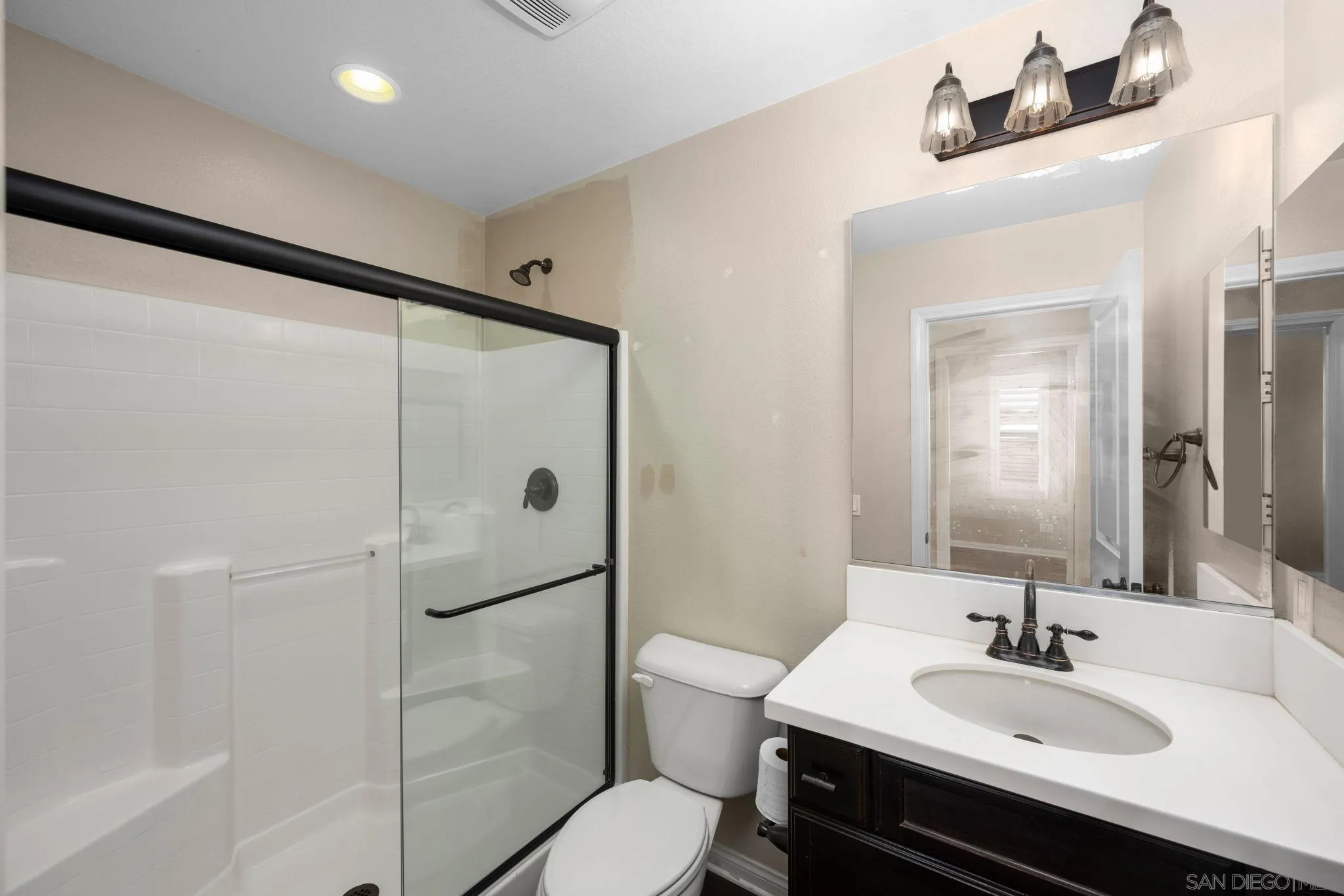 29885 Loy Drive Menifee, CA 92585 - Photo 31 of 75 a bathroom with a sink toilet and shower