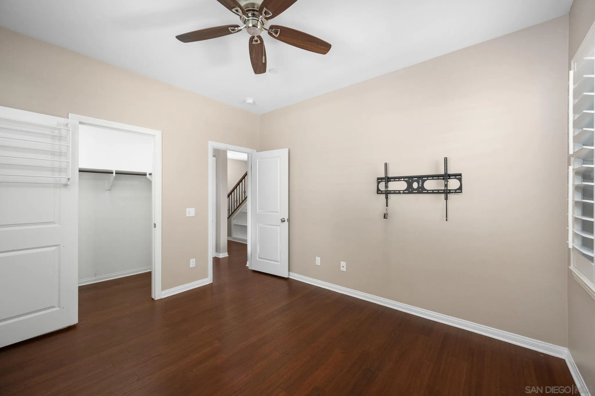 29885 Loy Drive Menifee, CA 92585 - Photo 32 of 75 a view of a room with wooden floor and ceiling fan