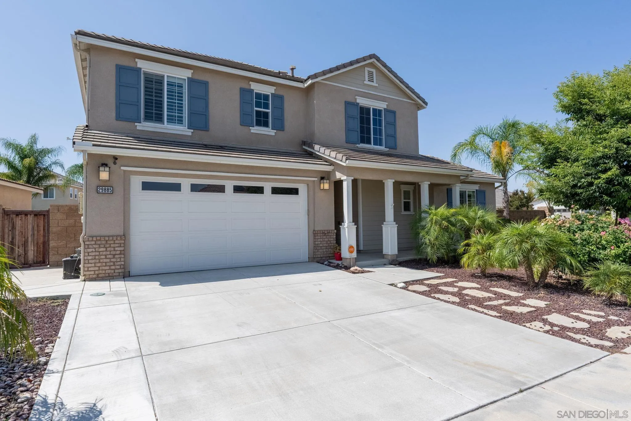 29885 Loy Drive Menifee, CA 92585 - Photo 35 of 75 a front view of a house with a garage