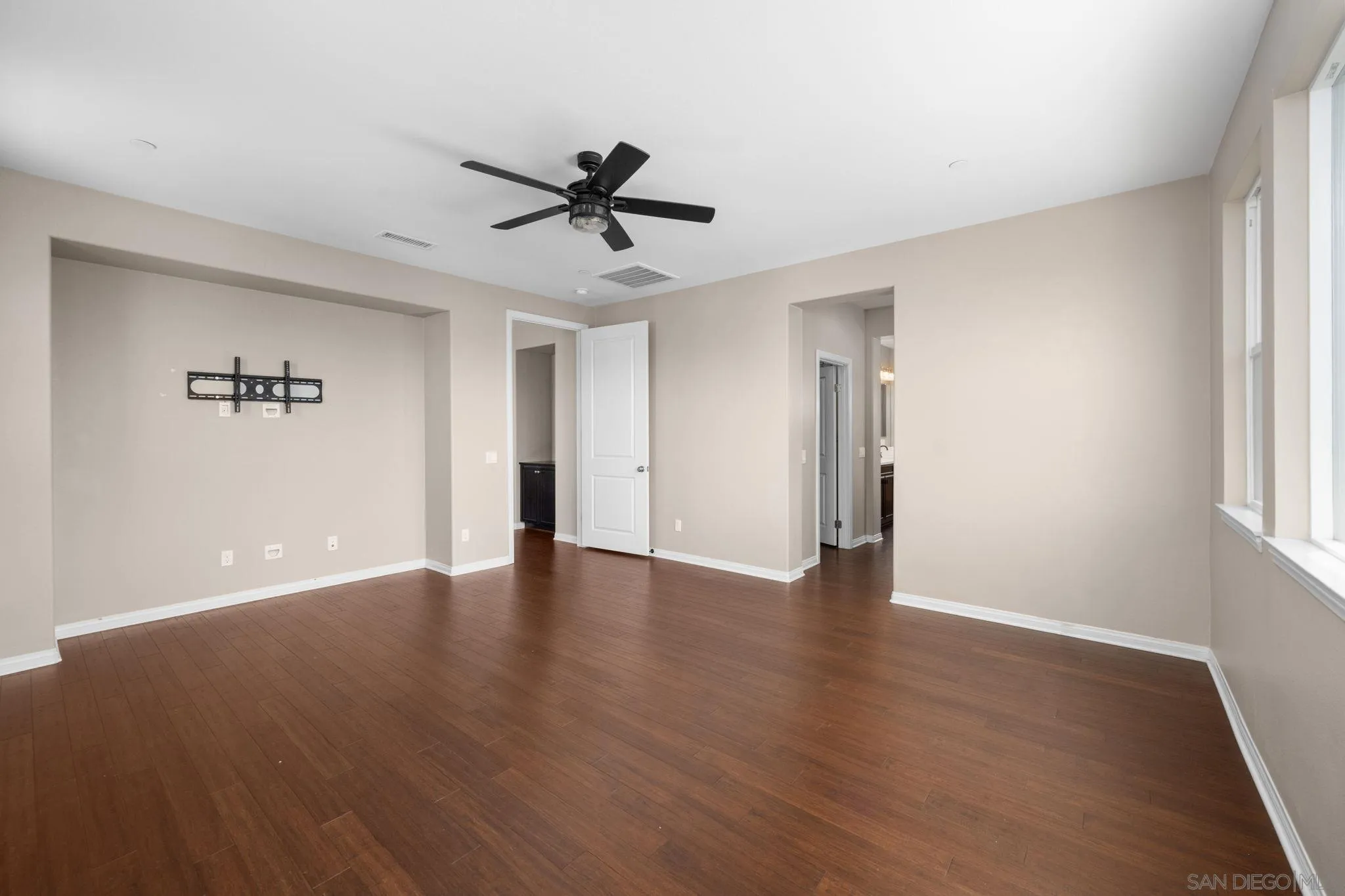 29885 Loy Drive Menifee, CA 92585 - Photo 6 of 75 a view of an empty room with wooden floor and a window