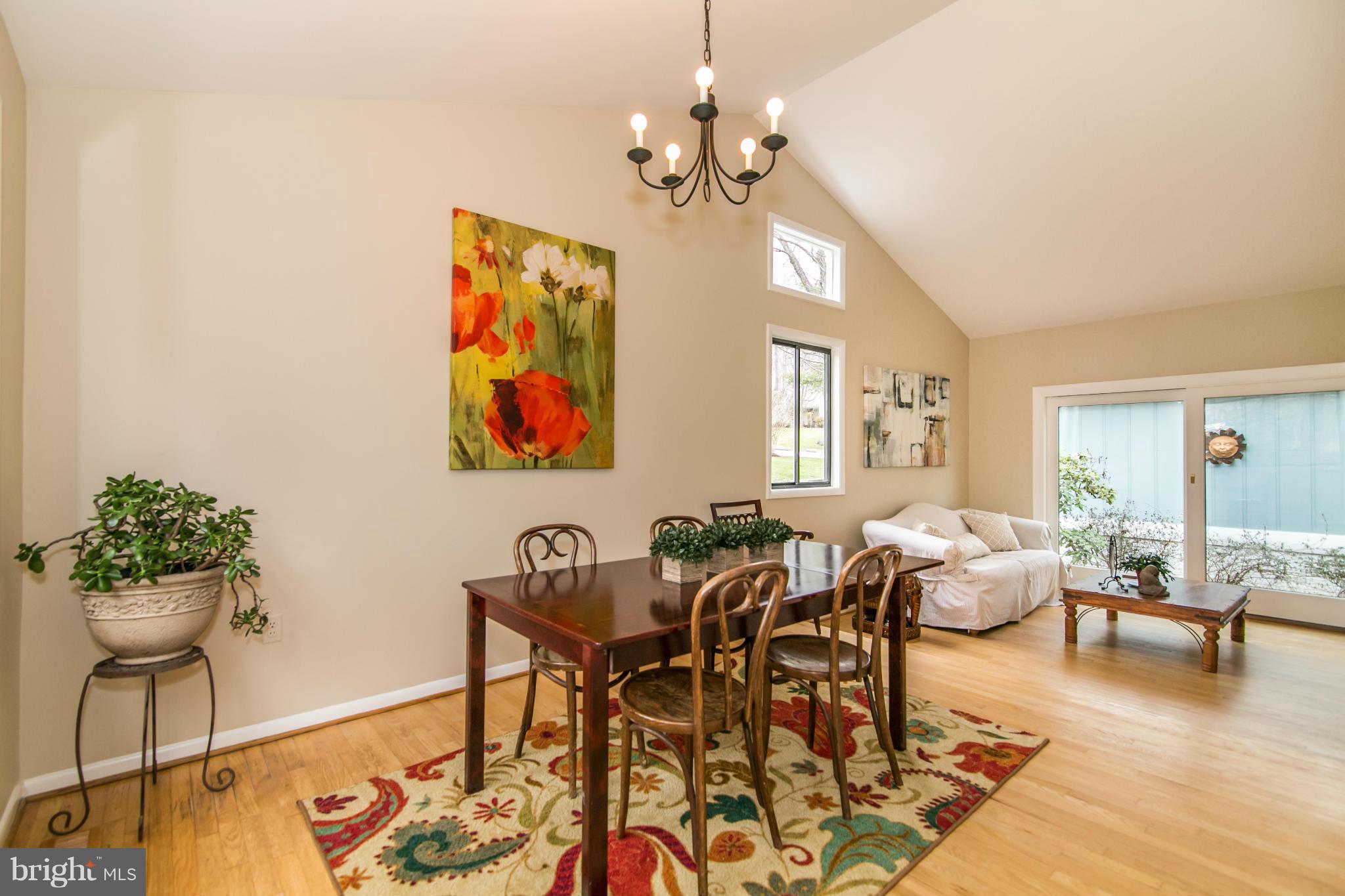 11821 Blue Spruce Road Reston, VA 20191 - Photo 6 of 28 a living room with fireplace furniture and a chandelier
