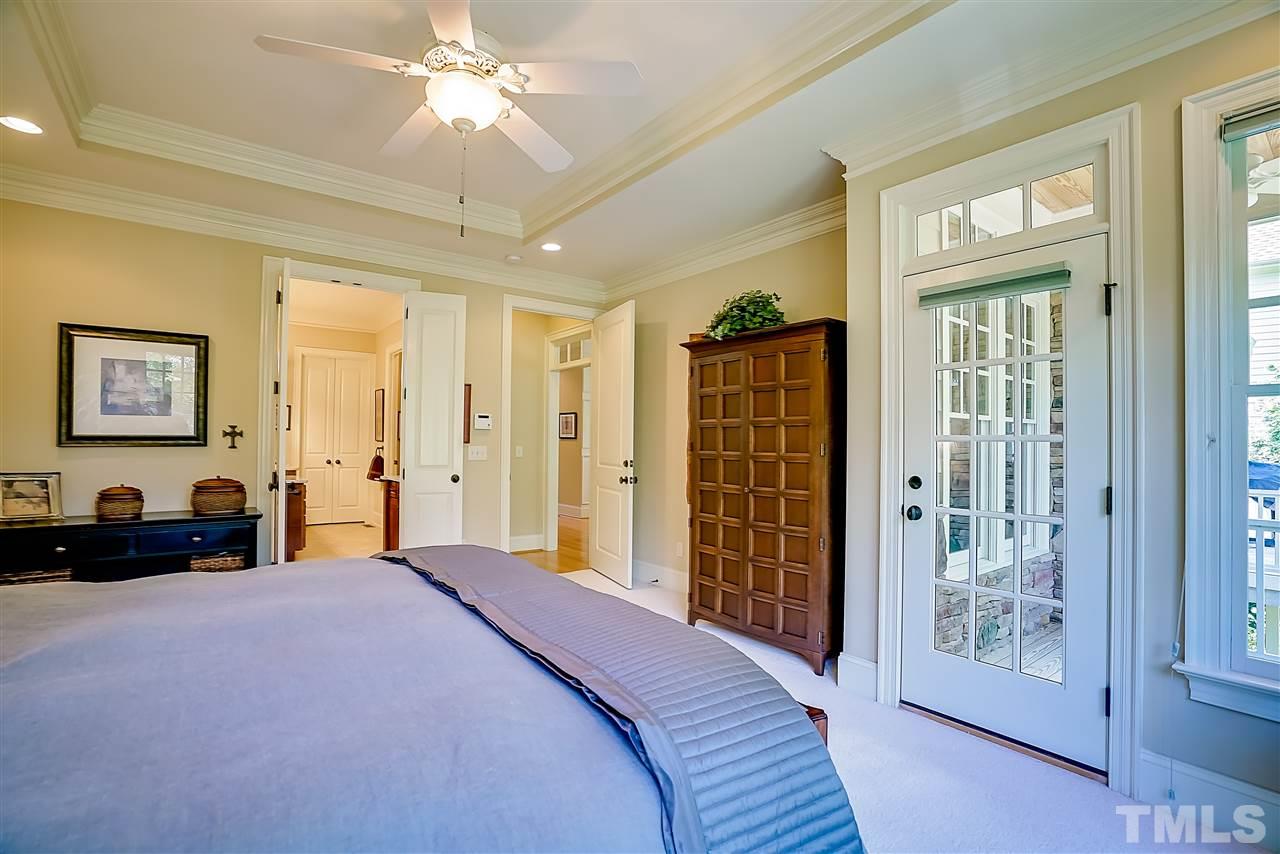 8636 Baybridge Wynd Raleigh, NC 27613 - Photo 12 of 25 a bedroom with a bed and a walk in closet
