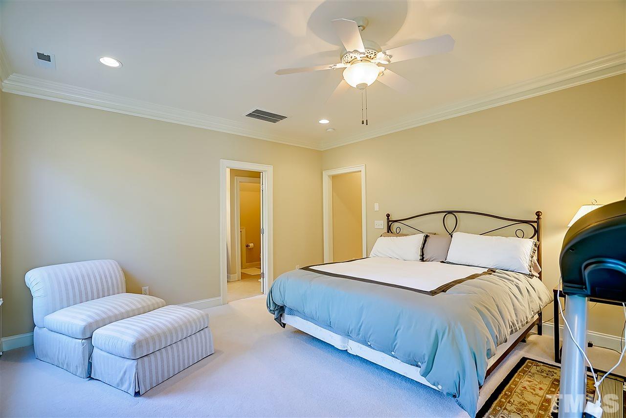 8636 Baybridge Wynd Raleigh, NC 27613 - Photo 14 of 25 a bedroom with bed couch and window
