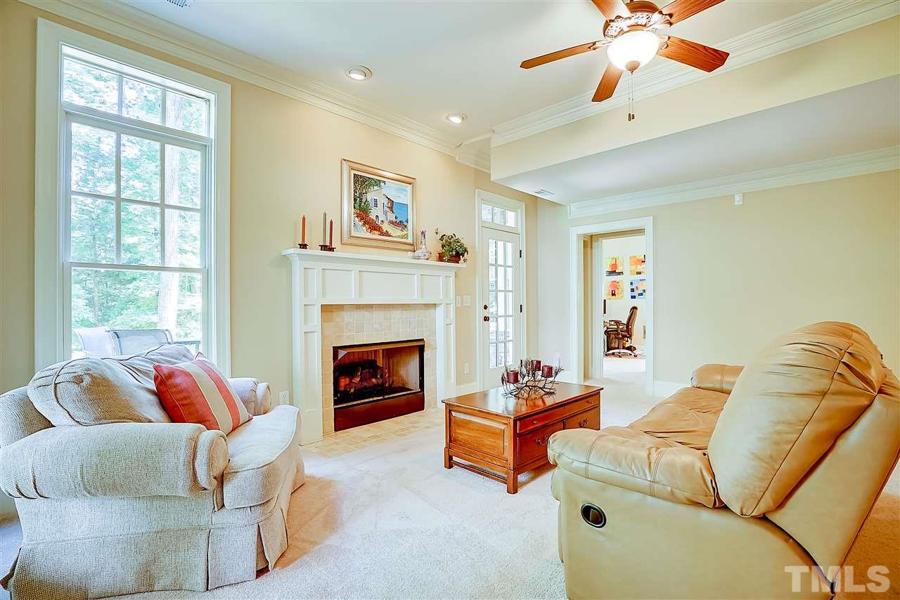 8636 Baybridge Wynd Raleigh, NC 27613 - Photo 20 of 25 a living room with furniture and a fireplace