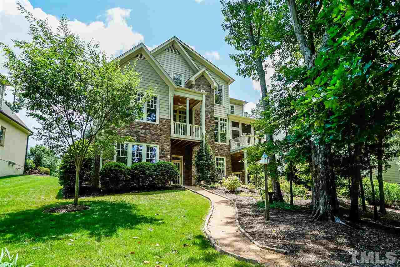 8636 Baybridge Wynd Raleigh, NC 27613 - Photo 23 of 25 a front view of a house with a yard
