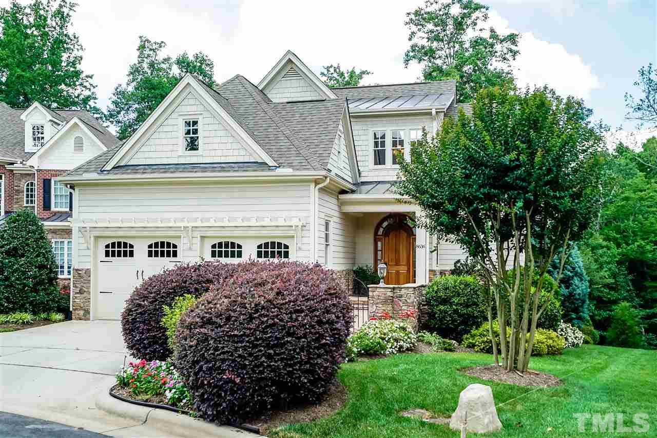 8636 Baybridge Wynd Raleigh, NC 27613 - Photo 25 of 25 a front view of a house with a garden