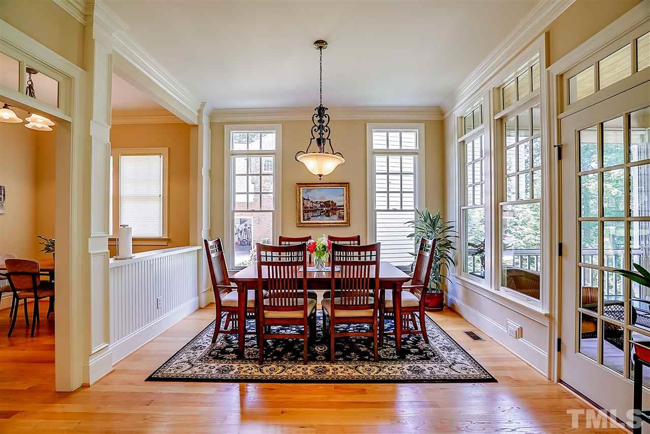 8636 Baybridge Wynd Raleigh, NC 27613 - Photo 8 of 25 a view of a dining room with furniture window and wooden floor