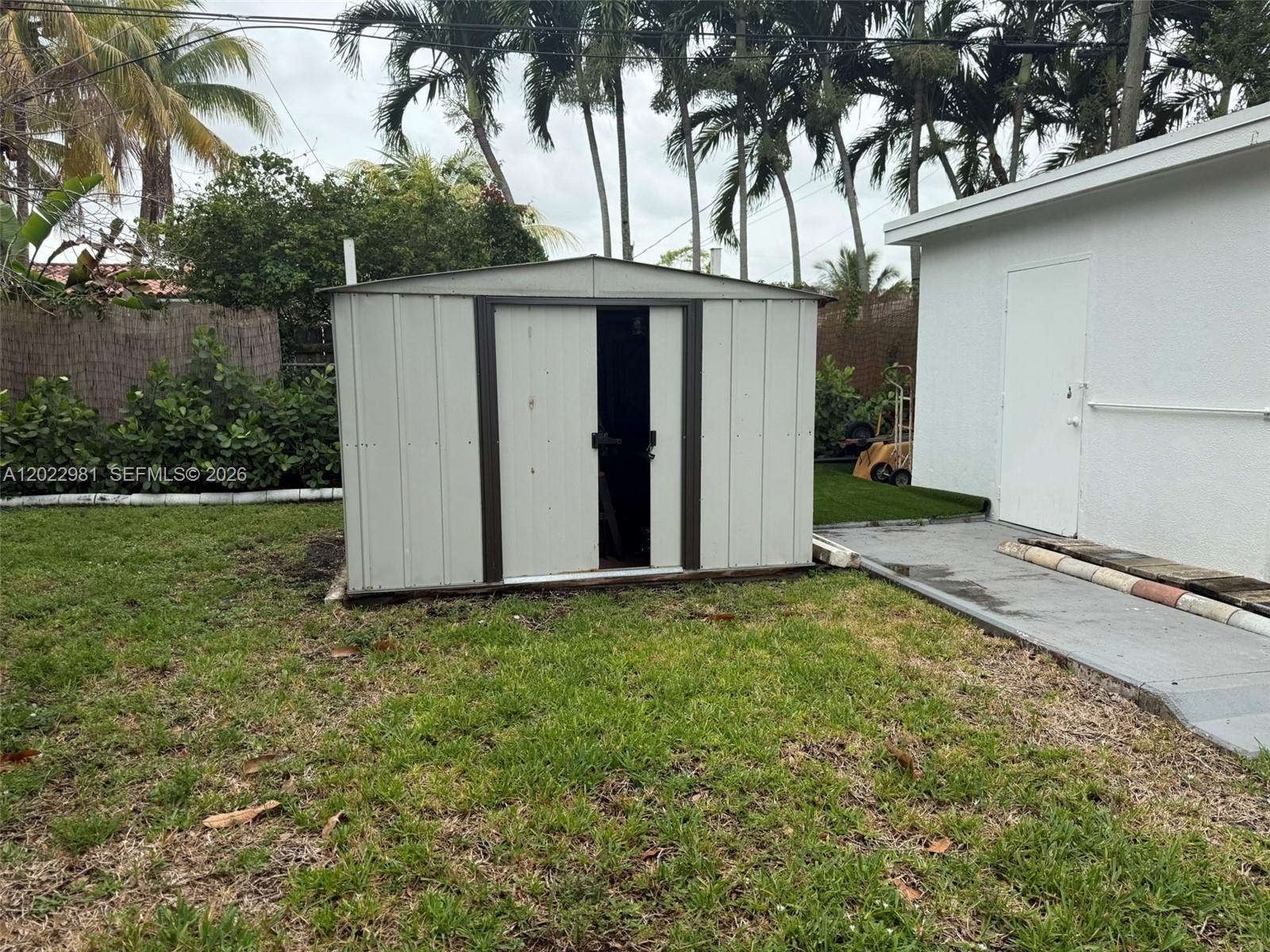 5940 Southwest 2nd Street Miami, FL 33144 - Photo 10 of 22 a view of a house with a yard