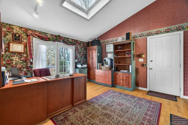 a living room with furniture and a rug