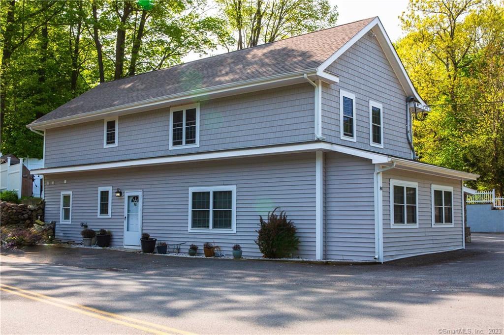 84 North Salem Road Ridgefield, CT 06877 - Photo 1 of 1 a front view of a house with a garage
