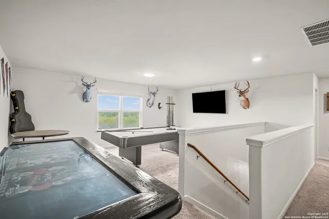 a view of a living room with a flat screen tv