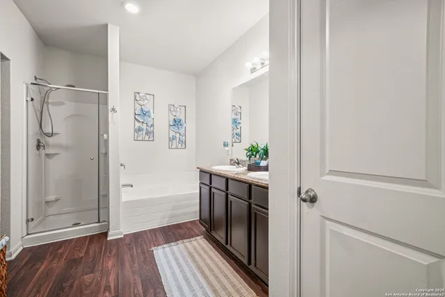 a bathroom with a shower and a sink