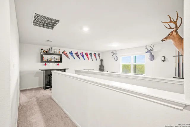 a bedroom with a bed couch and a window