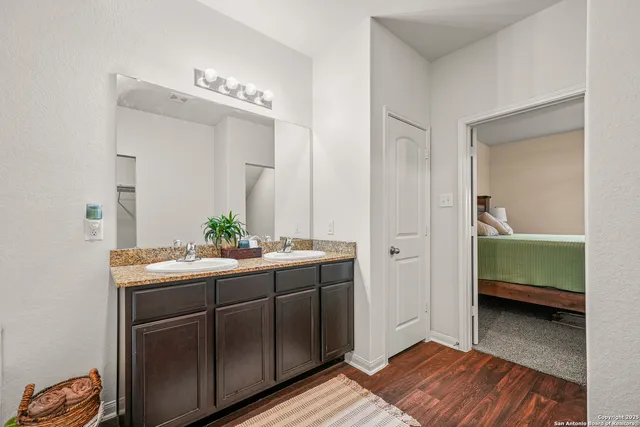 a en suite bathroom with a sink and mirror
