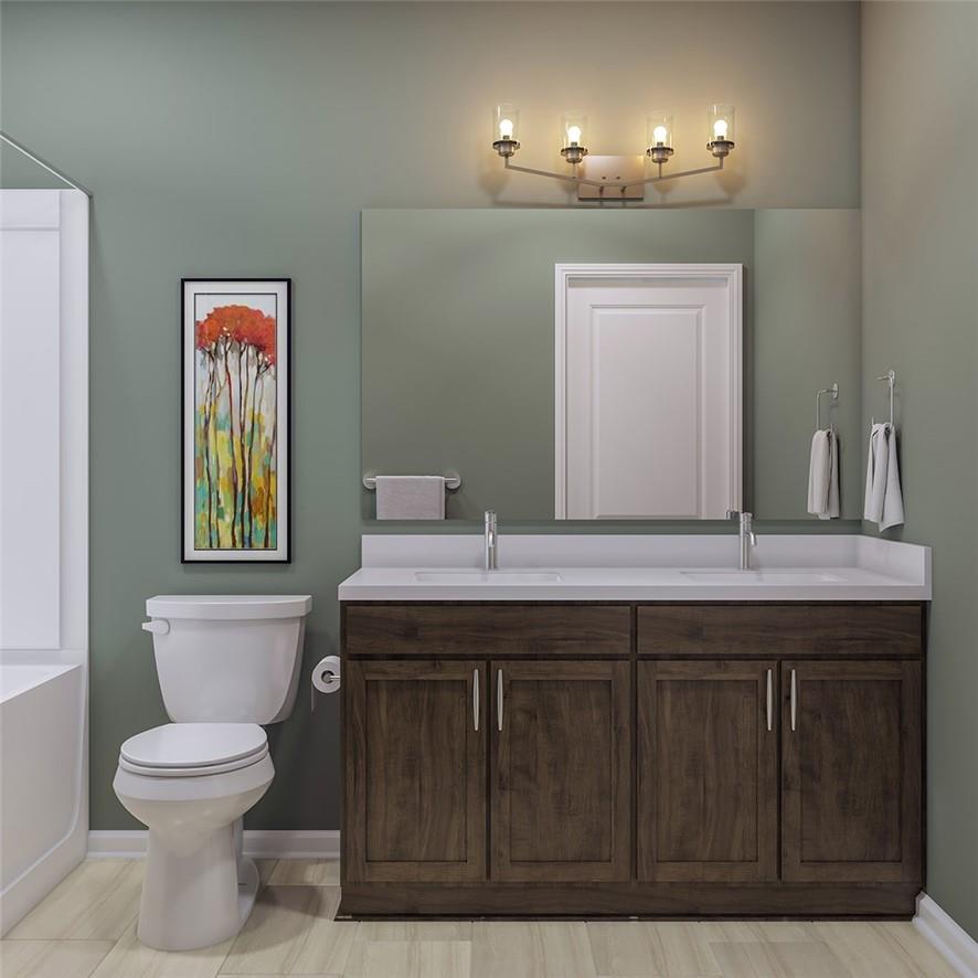 1026 Grays Ml Road Charlotte, NC 28215 - Photo 12 of 18 a bathroom with a sink a toilet and mirror