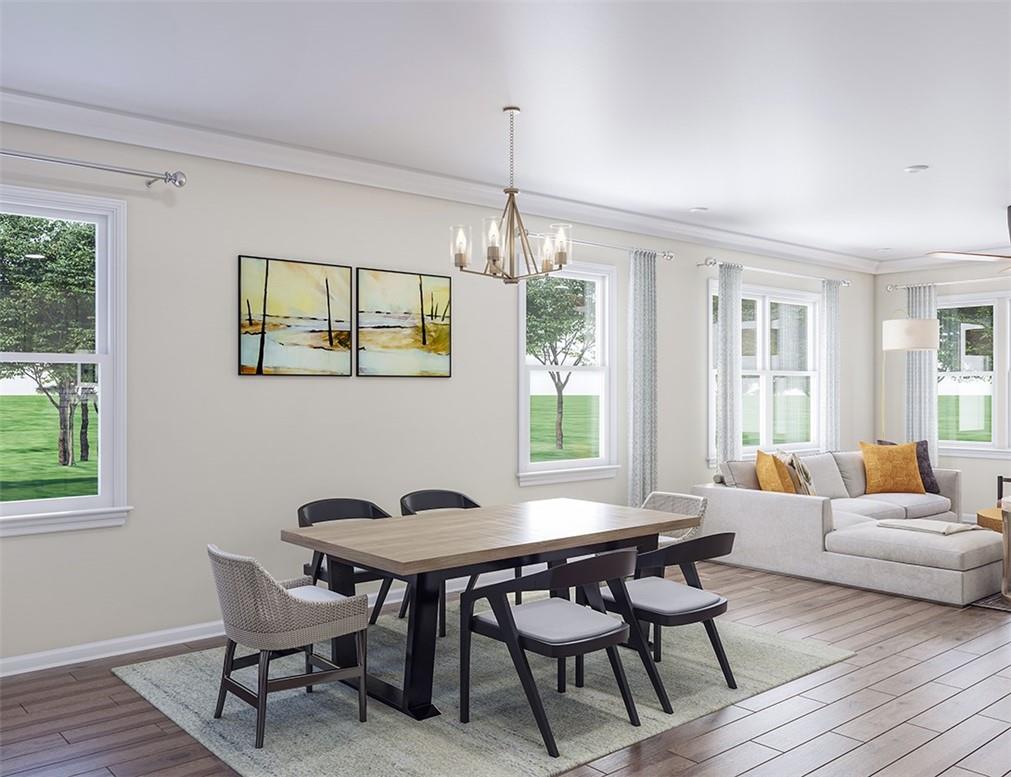 1026 Grays Ml Road Charlotte, NC 28215 - Photo 4 of 18 a dining room with furniture a chandelier and wooden floor