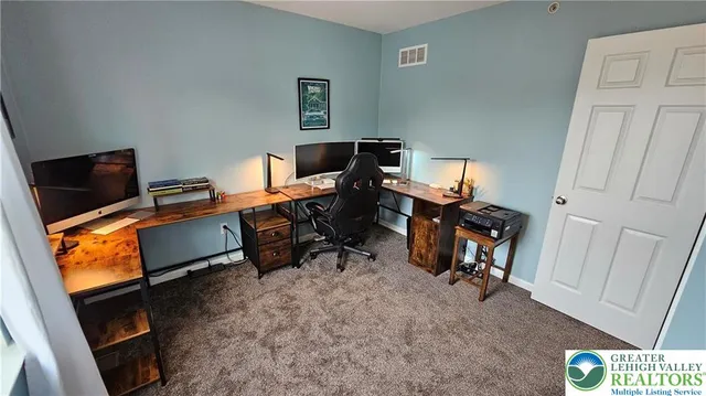 a room with furniture and a flat screen tv