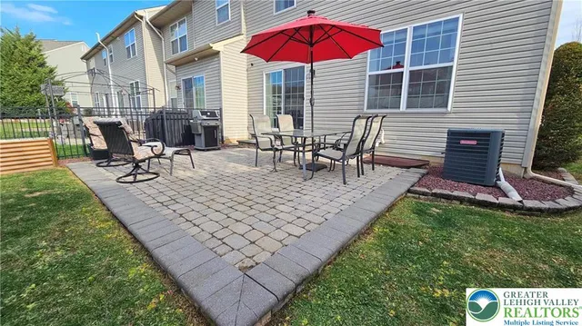 a view of a backyard with sitting area and furniture