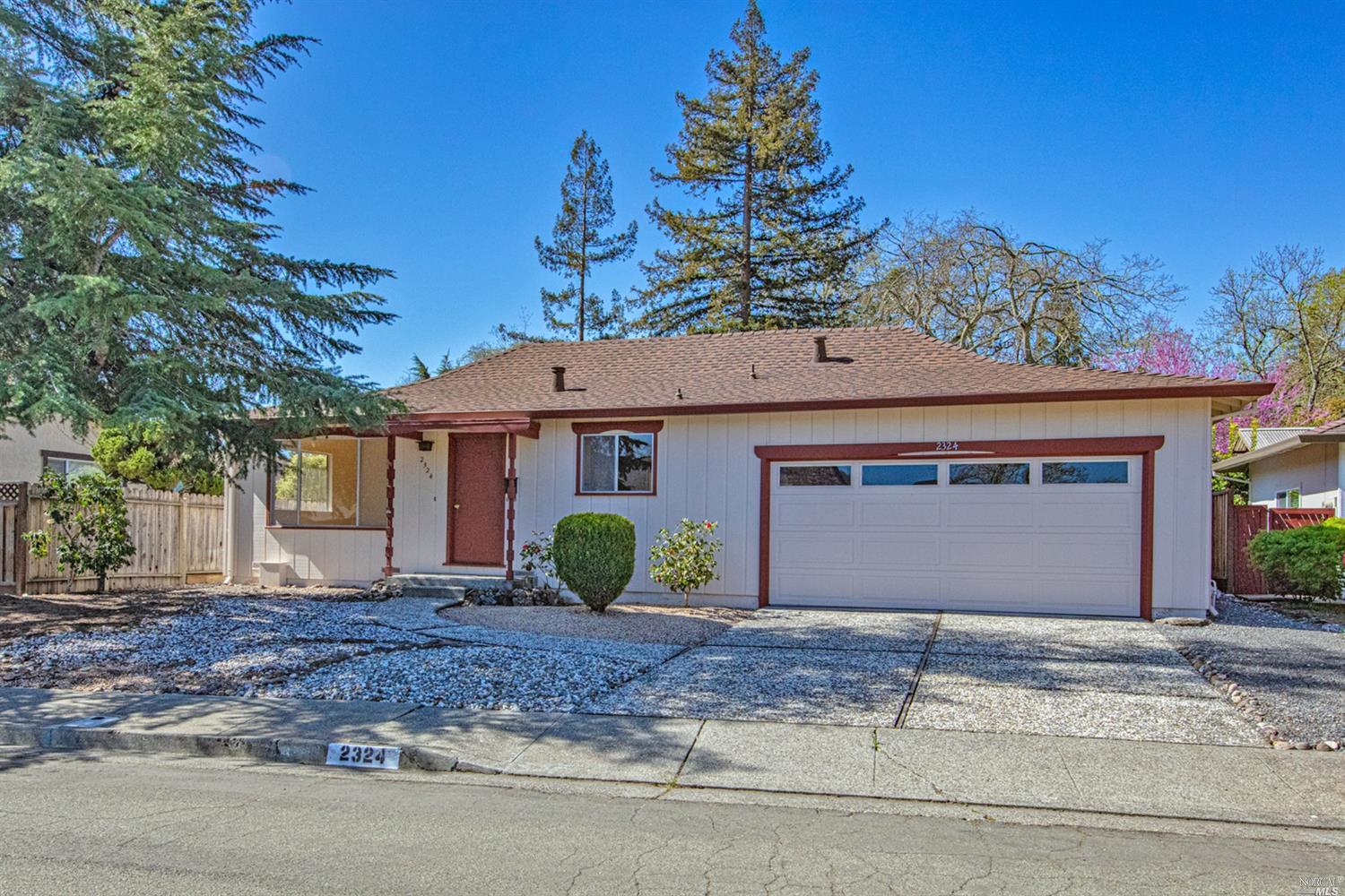 2324 Stonegate Court Santa Rosa, CA 95409 - Photo 1 of 1 a front view of a house with a yard and garage