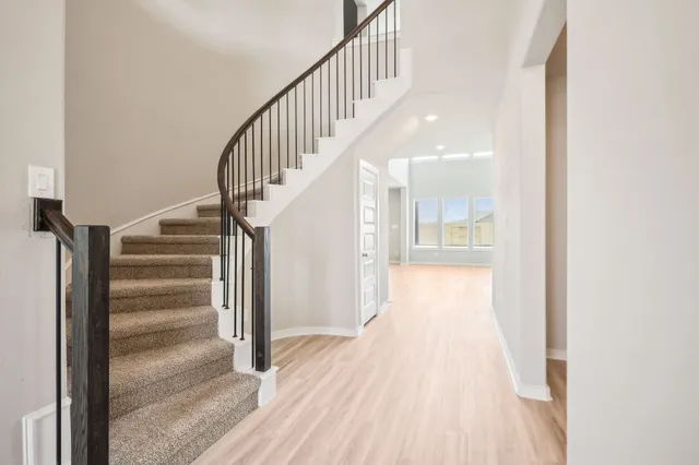 a view of entryway with wooden floor