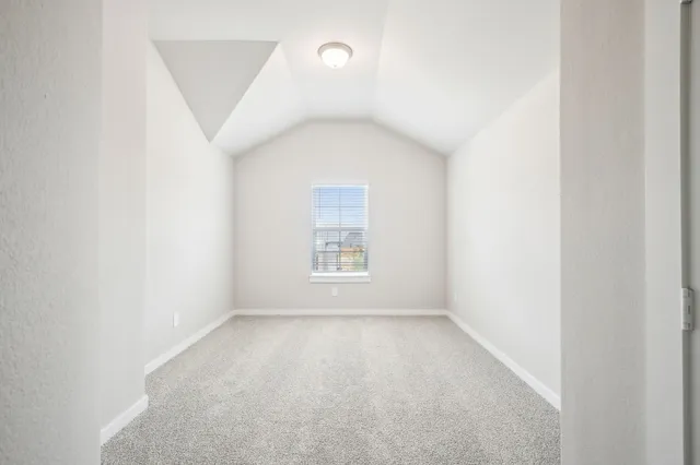 a bathroom with a bathtub shower sink vanity mirror and toilet