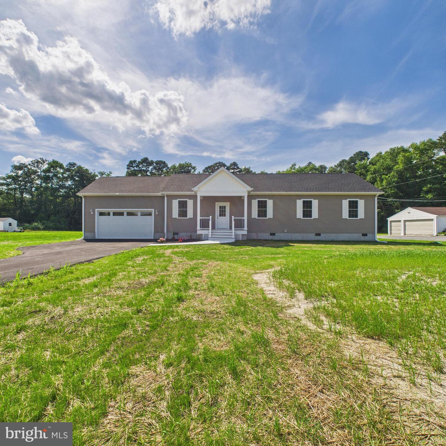 20168 Shingle Point Road Georgetown, DE 19947 - Photo 1 of 44 a view of a house with a big yard and potted plants