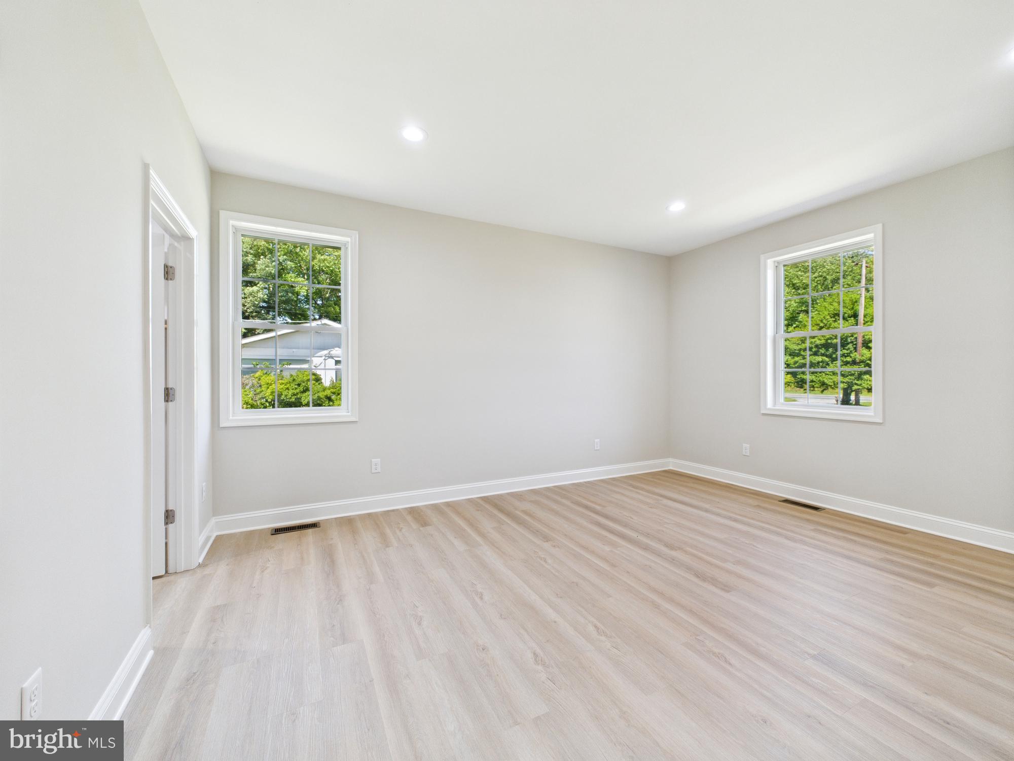20168 Shingle Point Road Georgetown, DE 19947 - Photo 13 of 44 an empty room with windows