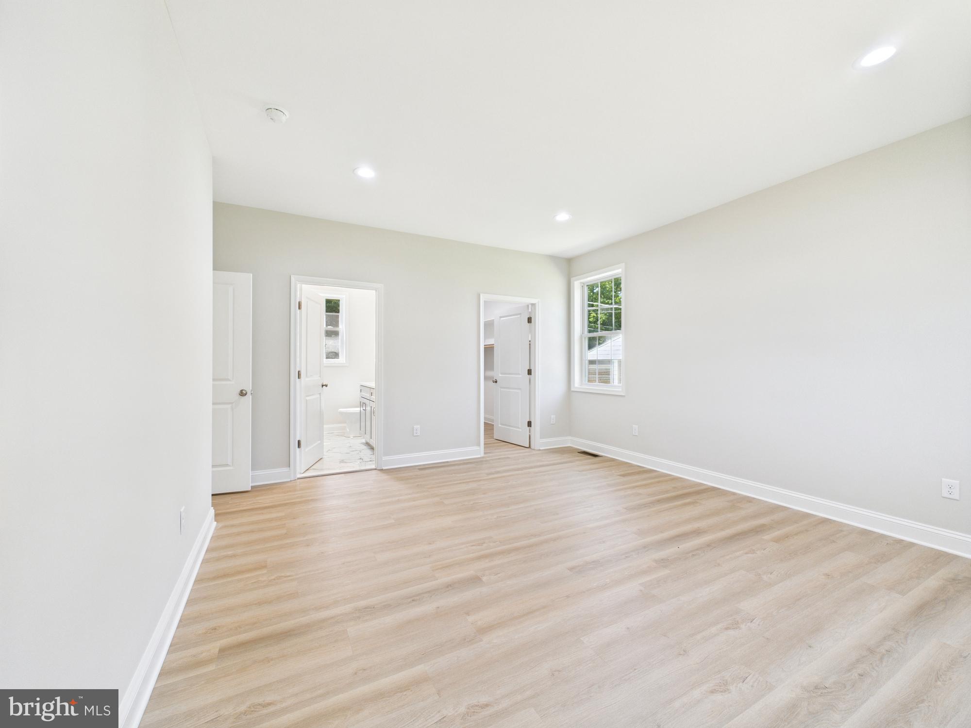 20168 Shingle Point Road Georgetown, DE 19947 - Photo 16 of 44 a view of an empty room with wooden floor