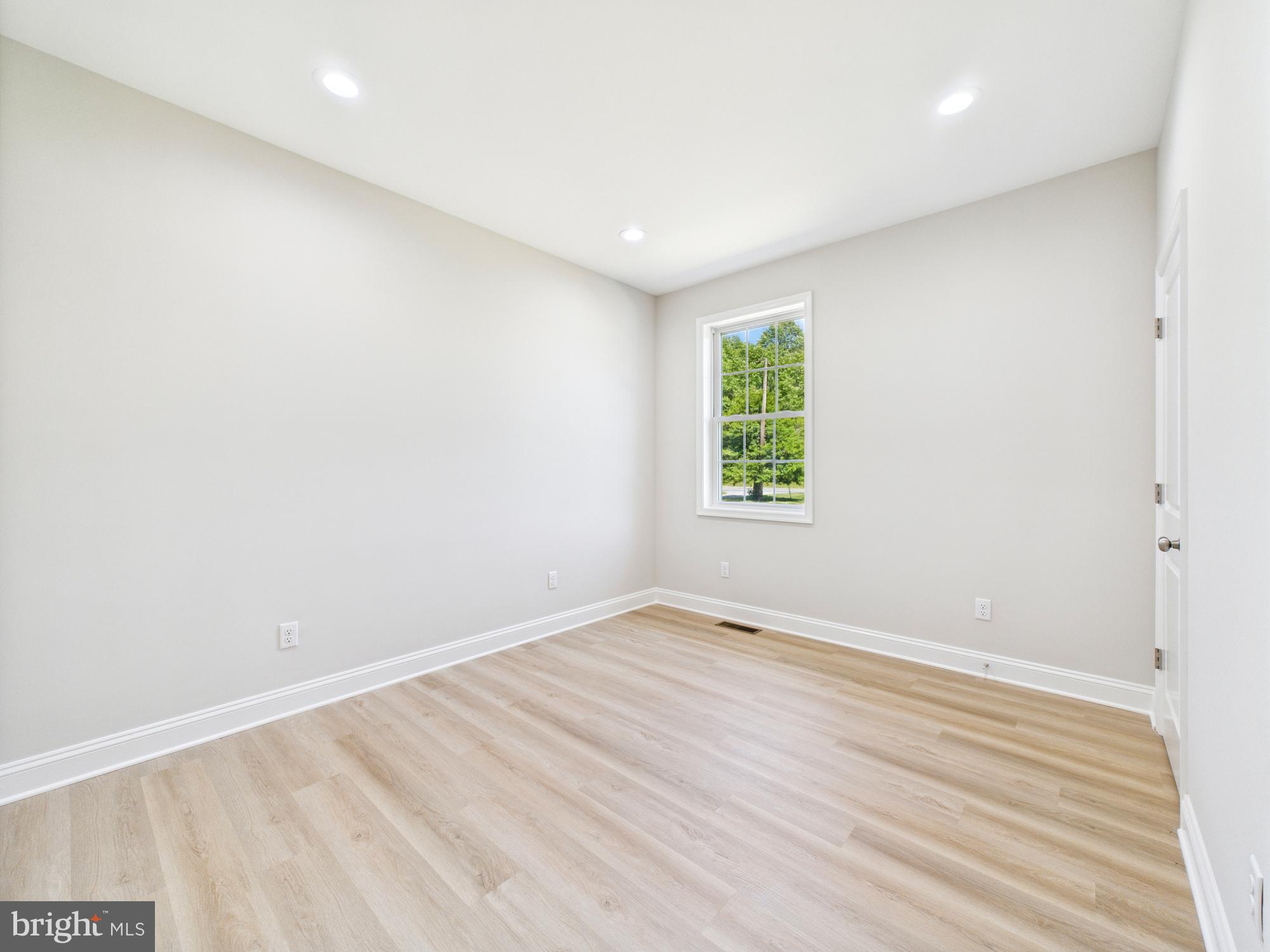 20168 Shingle Point Road Georgetown, DE 19947 - Photo 26 of 44 an empty room with windows