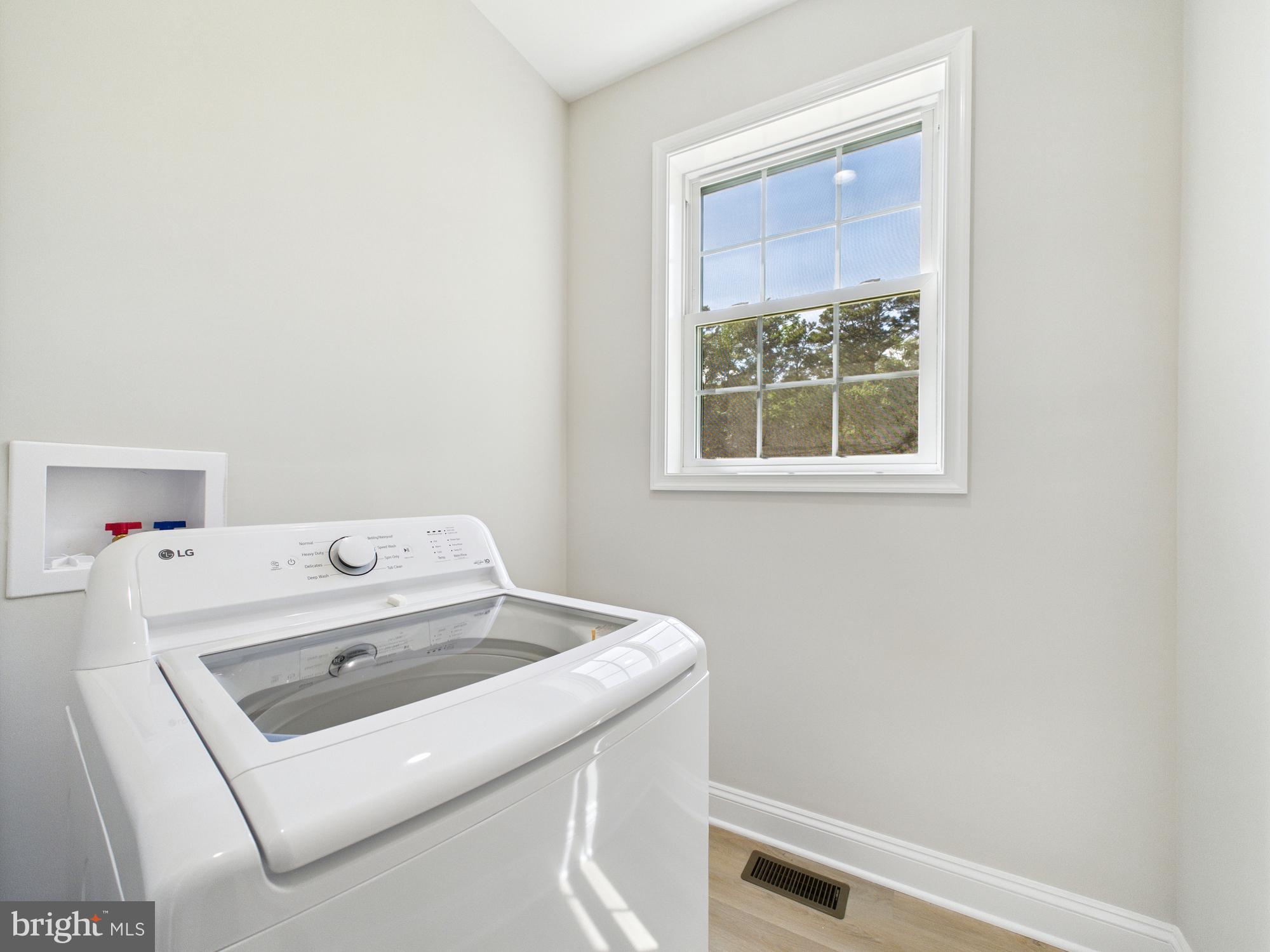 20168 Shingle Point Road Georgetown, DE 19947 - Photo 34 of 44 a utility room with dryer and washer