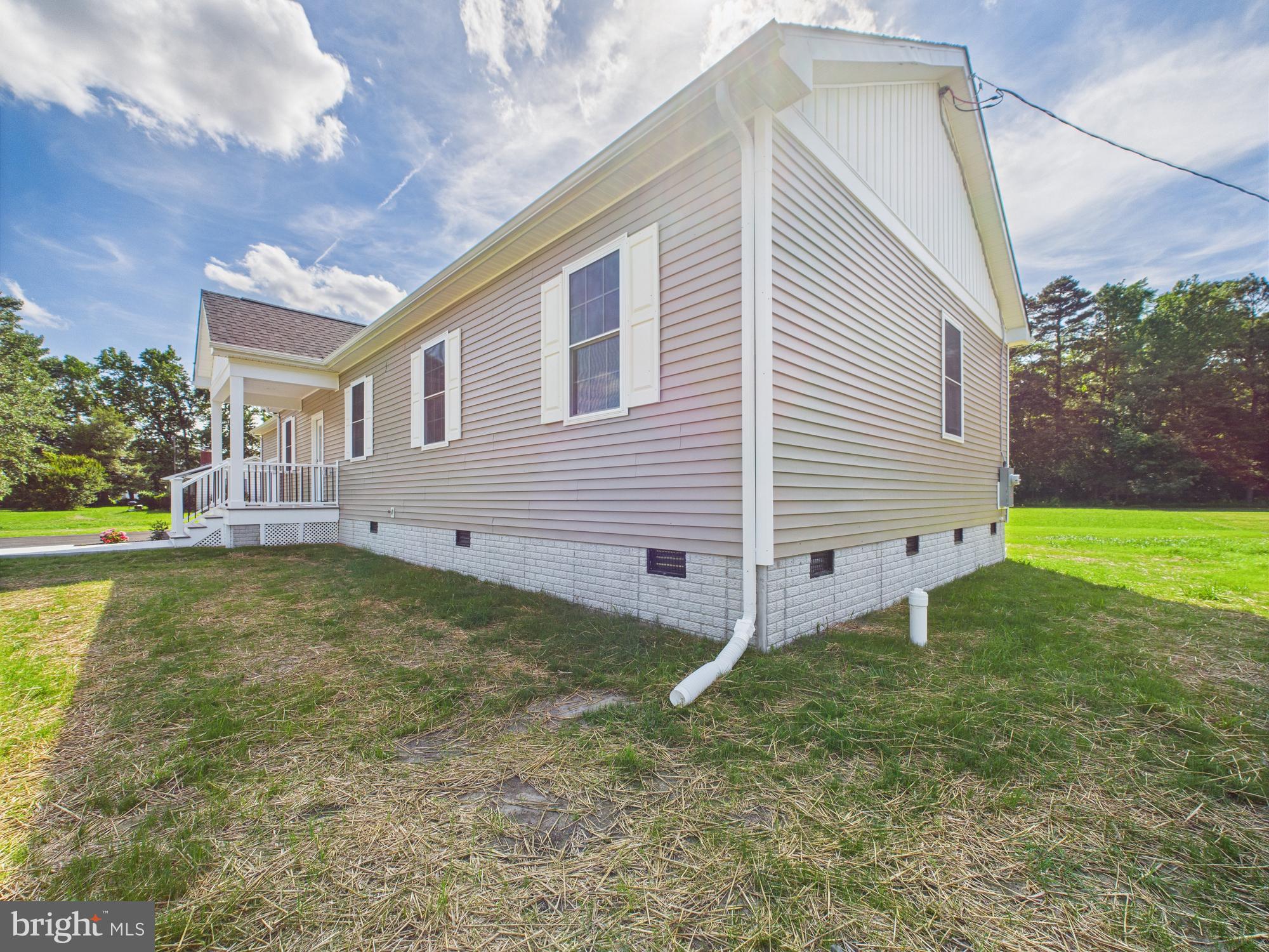 20168 Shingle Point Road Georgetown, DE 19947 - Photo 40 of 44 a view of a house with a yard
