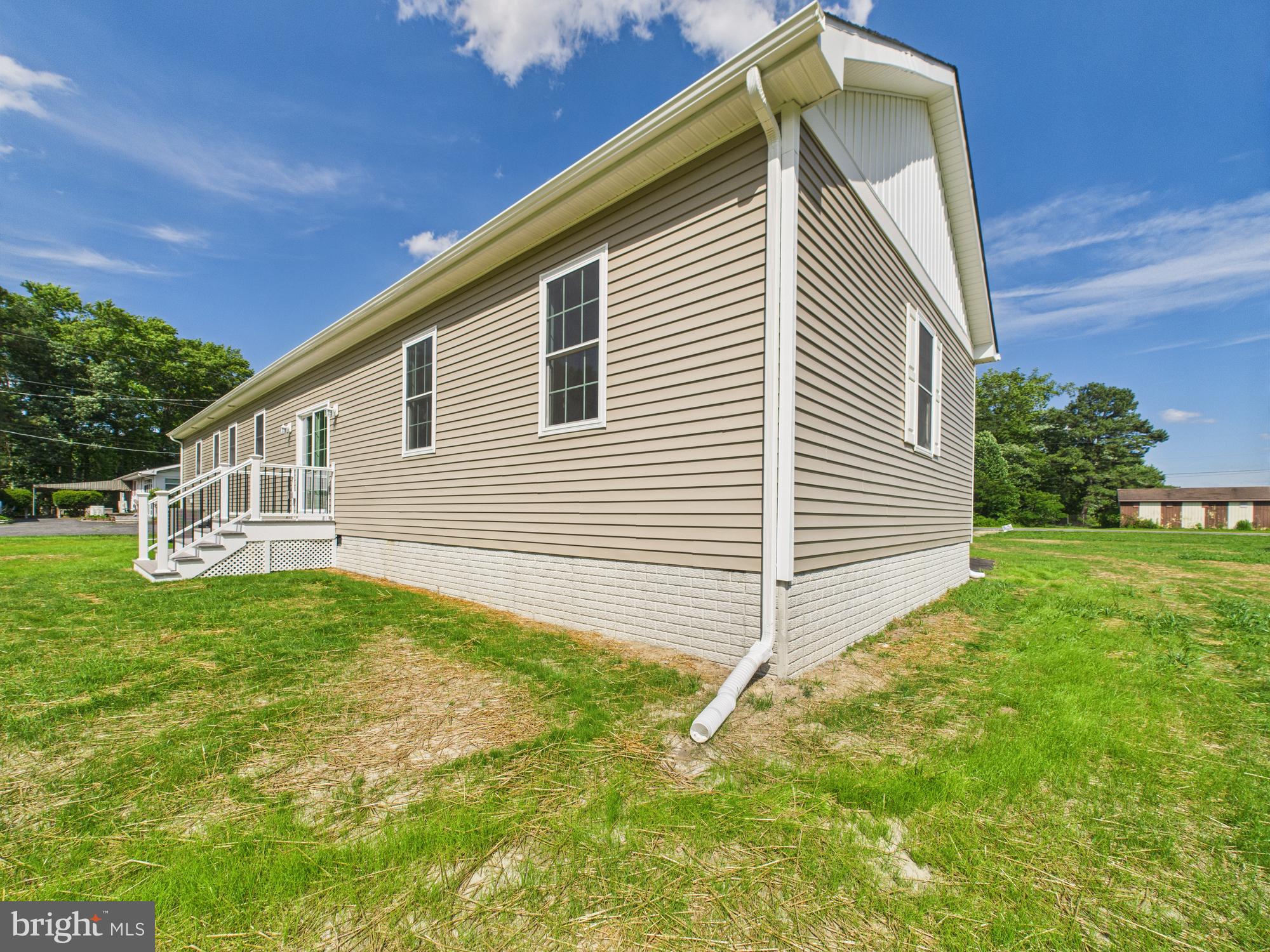 20168 Shingle Point Road Georgetown, DE 19947 - Photo 42 of 44 a view of a house with a backyard