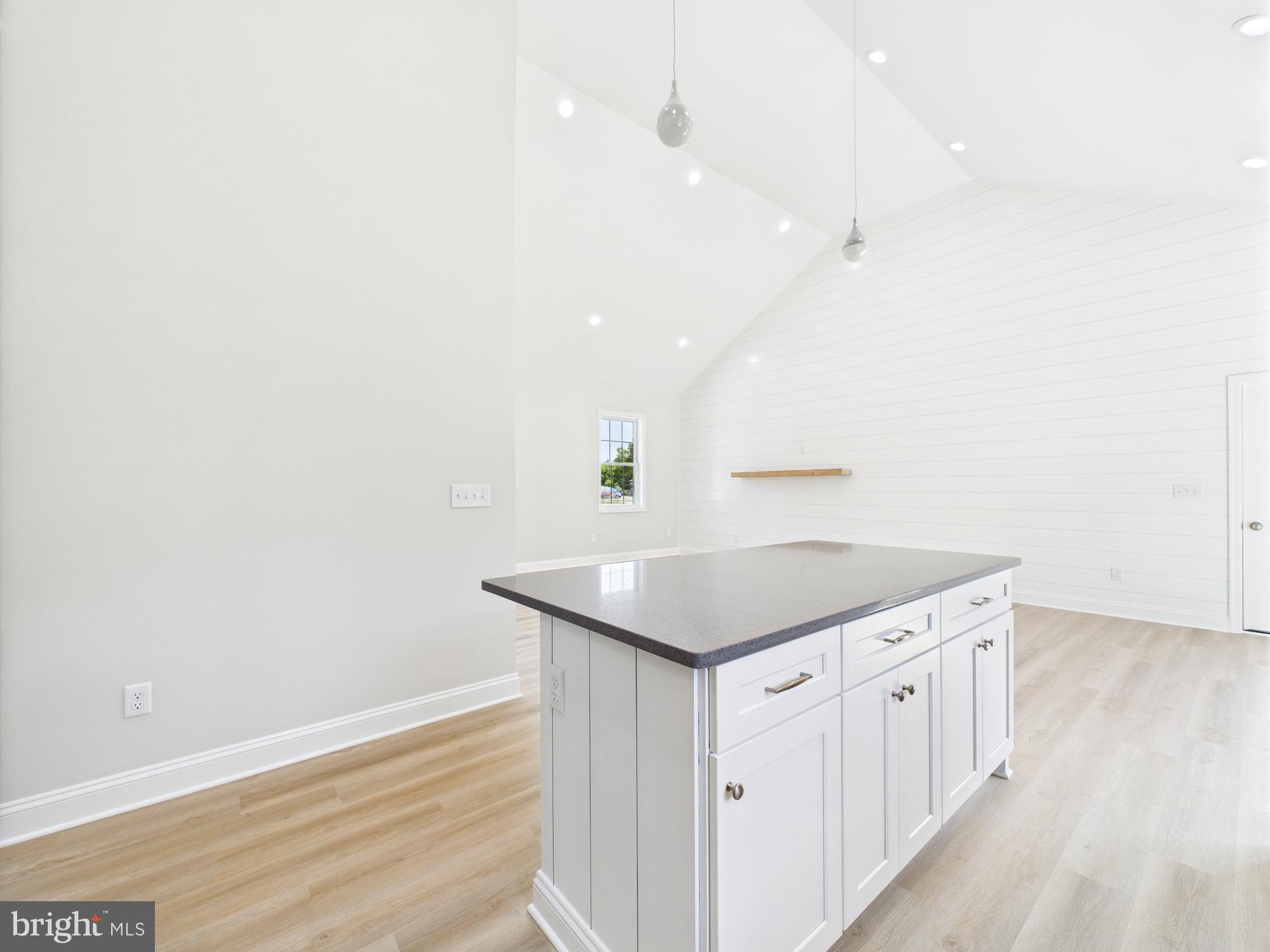 20168 Shingle Point Road Georgetown, DE 19947 - Photo 10 of 44 a kitchen with a sink cabinets and wooden floor
