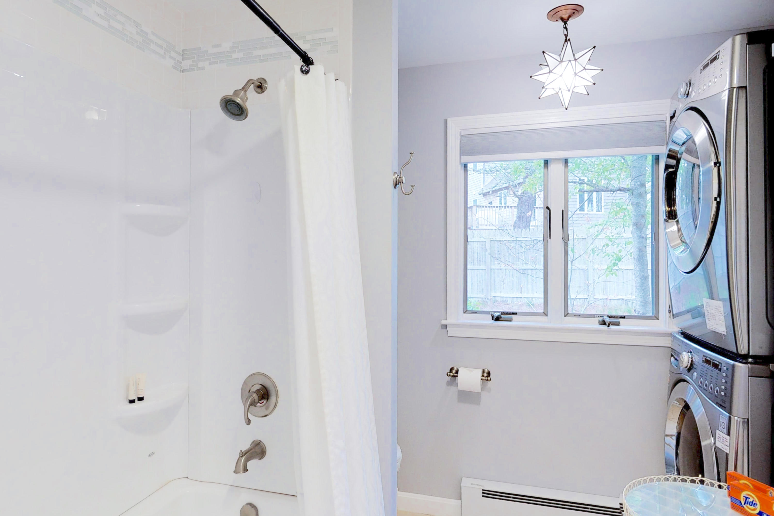 320 Cove View Road Wellfleet, MA 02667 - Photo 15 of 42 a bathroom with a window a sink and a mirror