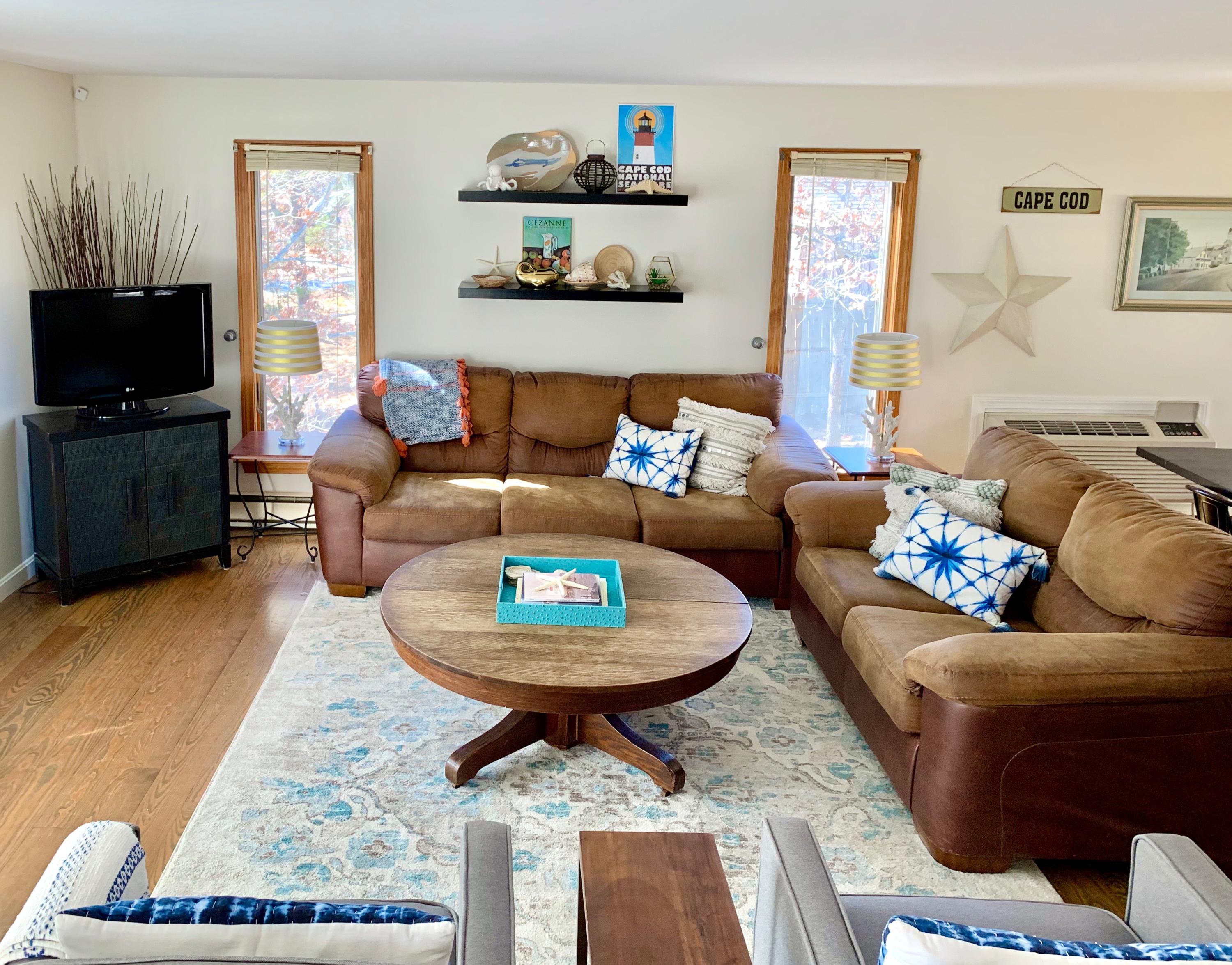 320 Cove View Road Wellfleet, MA 02667 - Photo 2 of 42 a living room with furniture and a flat screen tv