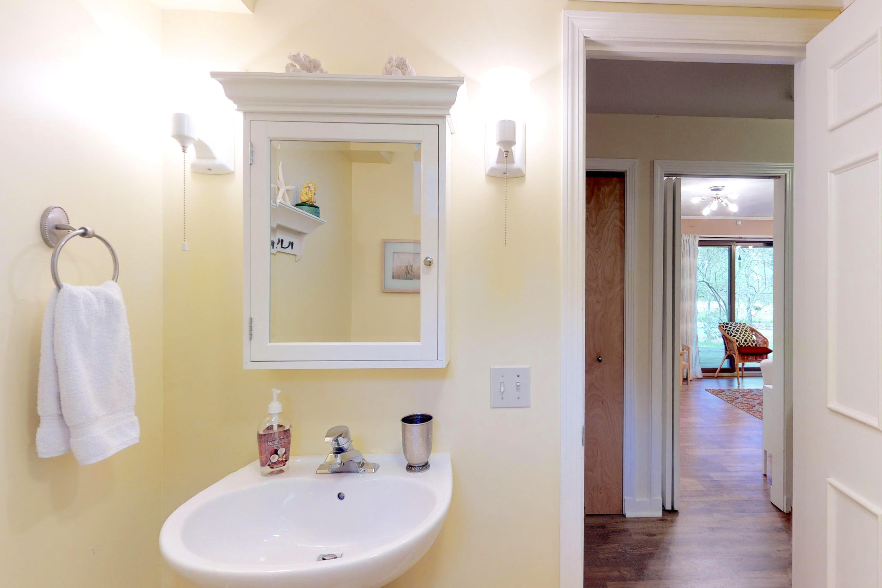 320 Cove View Road Wellfleet, MA 02667 - Photo 23 of 42 a bathroom with a sink and mirror