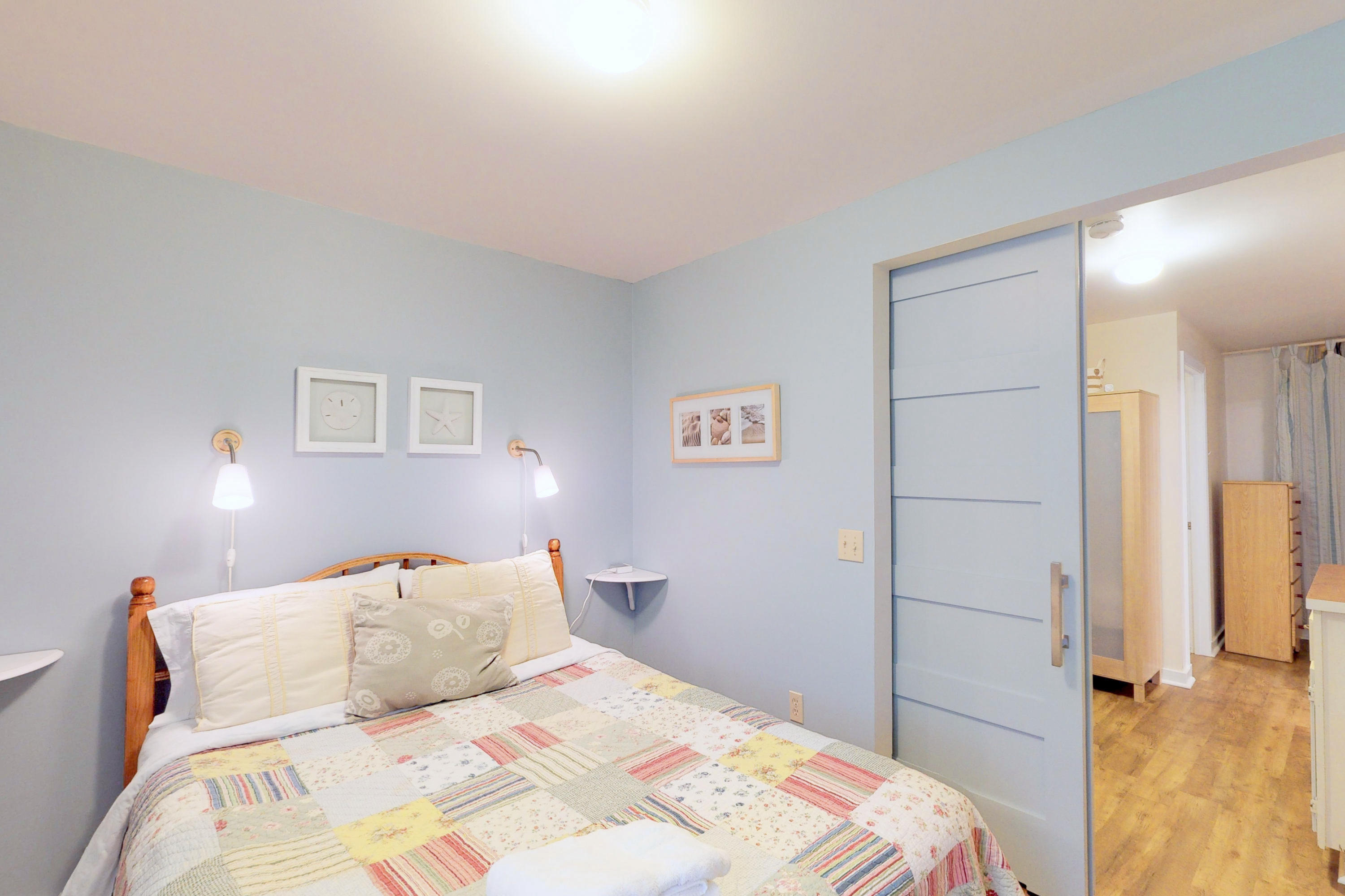 320 Cove View Road Wellfleet, MA 02667 - Photo 26 of 42 a bedroom with a bed and a painting