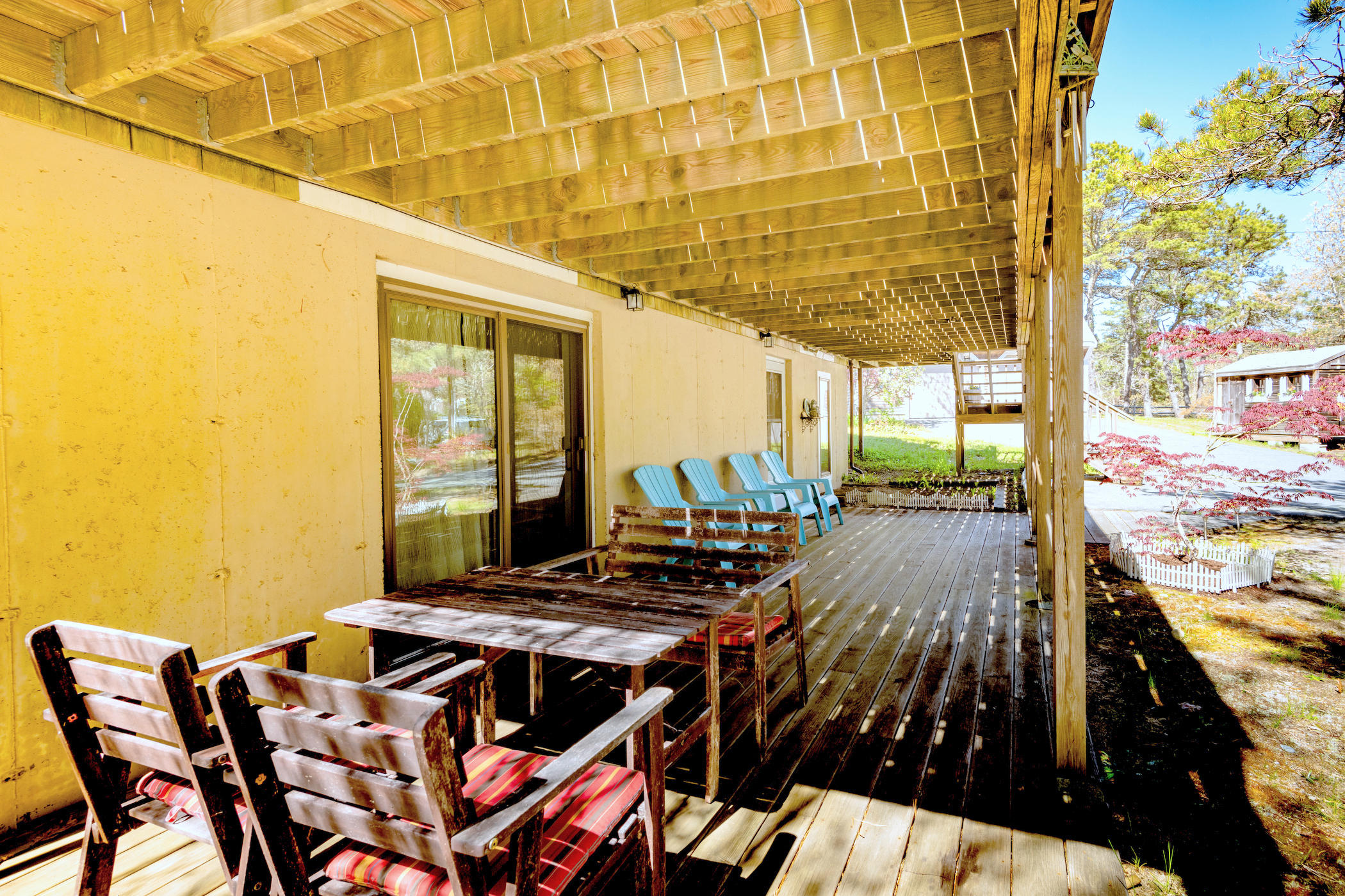 320 Cove View Road Wellfleet, MA 02667 - Photo 29 of 42 a view of a balcony dining table and chairs