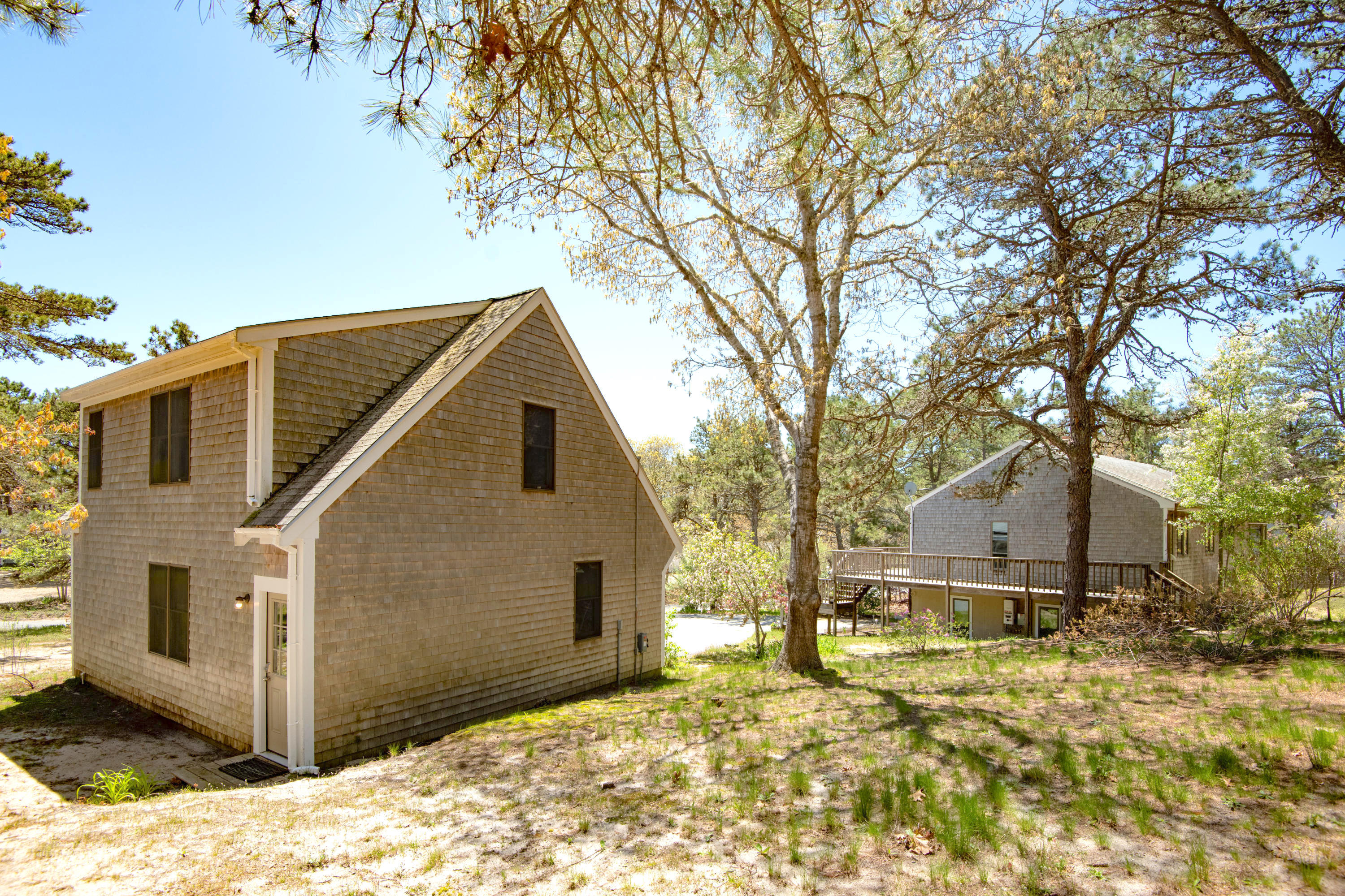320 Cove View Road Wellfleet, MA 02667 - Photo 36 of 42 a view of a house with a yard