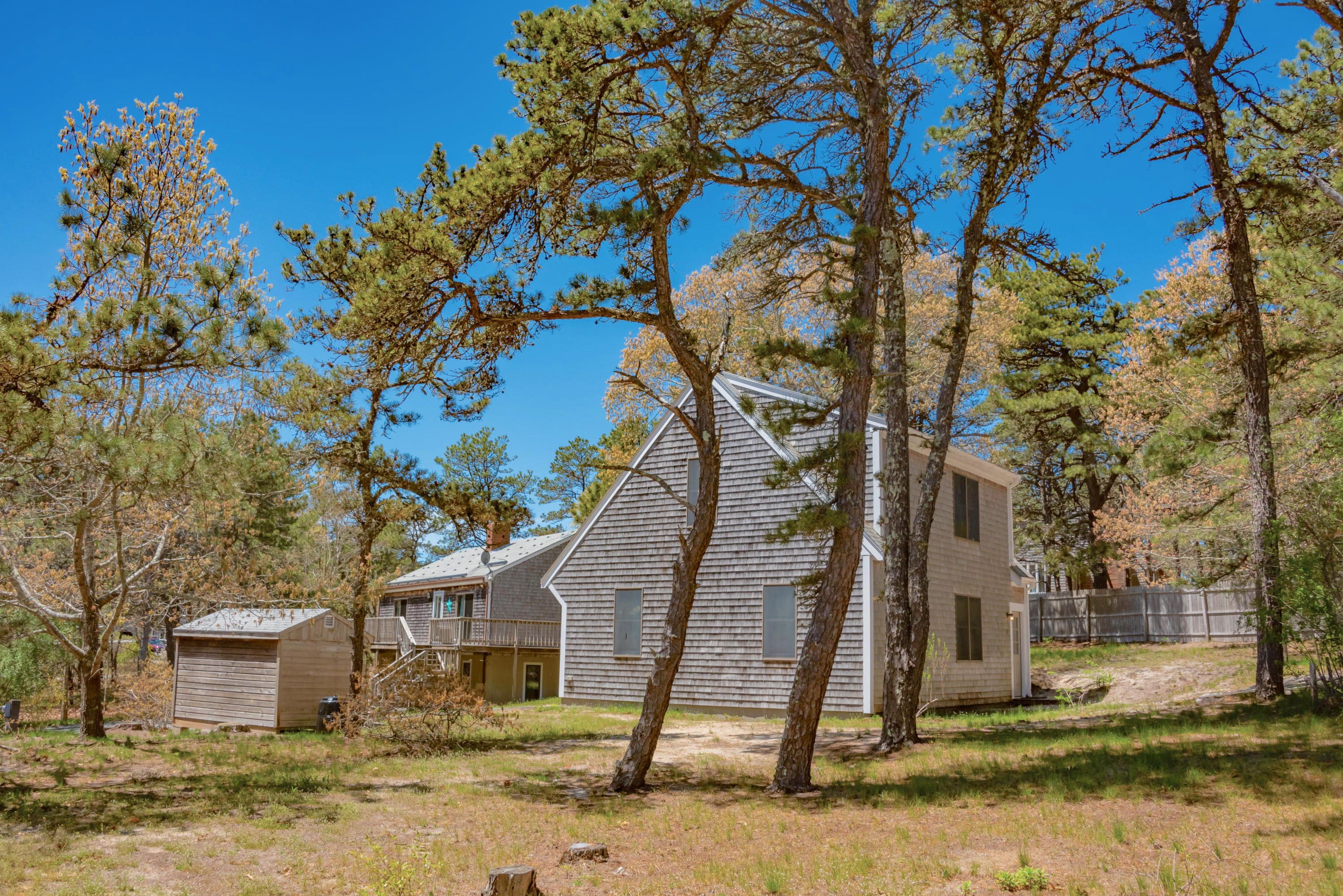 320 Cove View Road Wellfleet, MA 02667 - Photo 39 of 42 a front view of a house with a yard