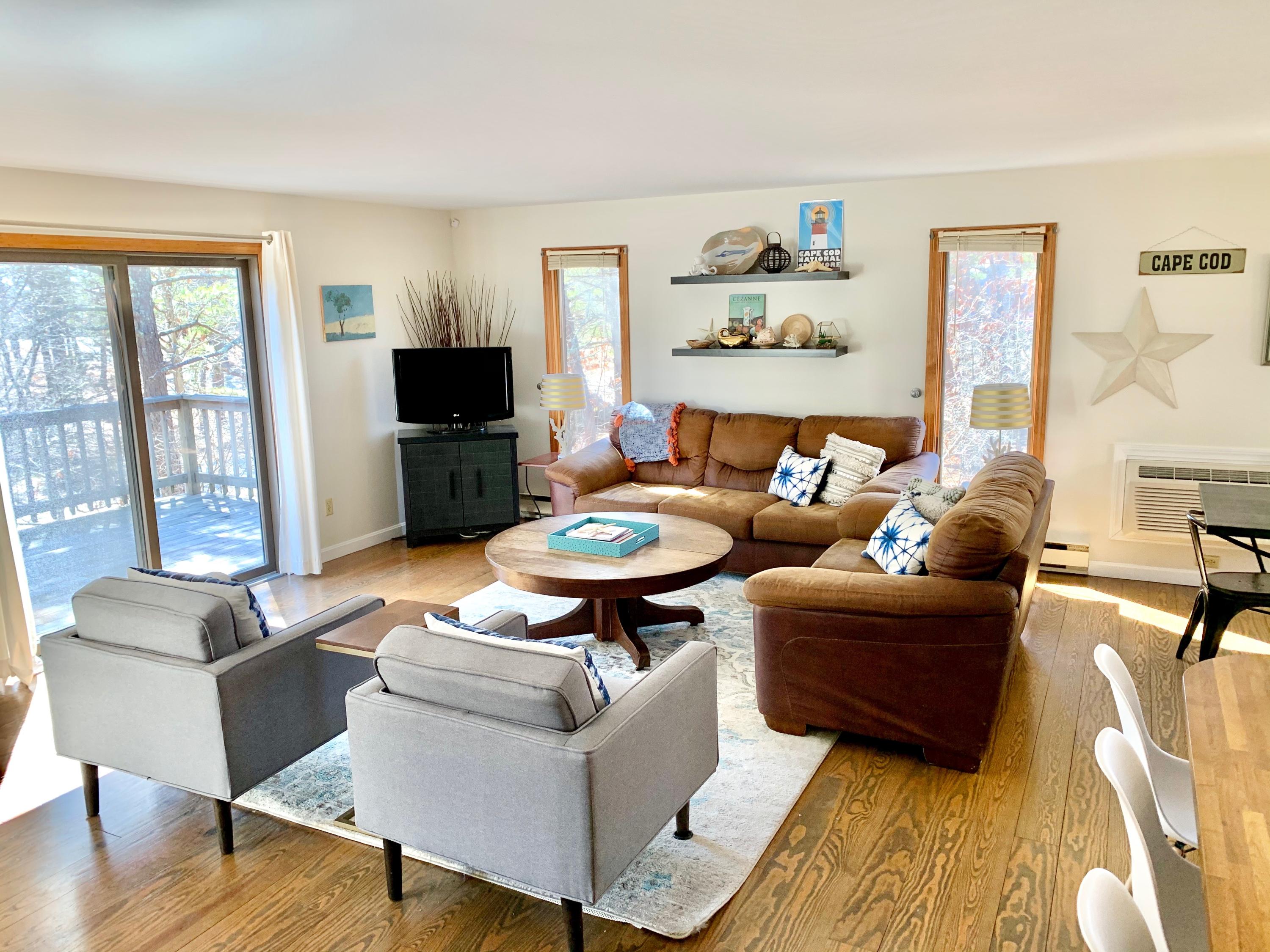 320 Cove View Road Wellfleet, MA 02667 - Photo 5 of 42 a living room with furniture and a flat screen tv