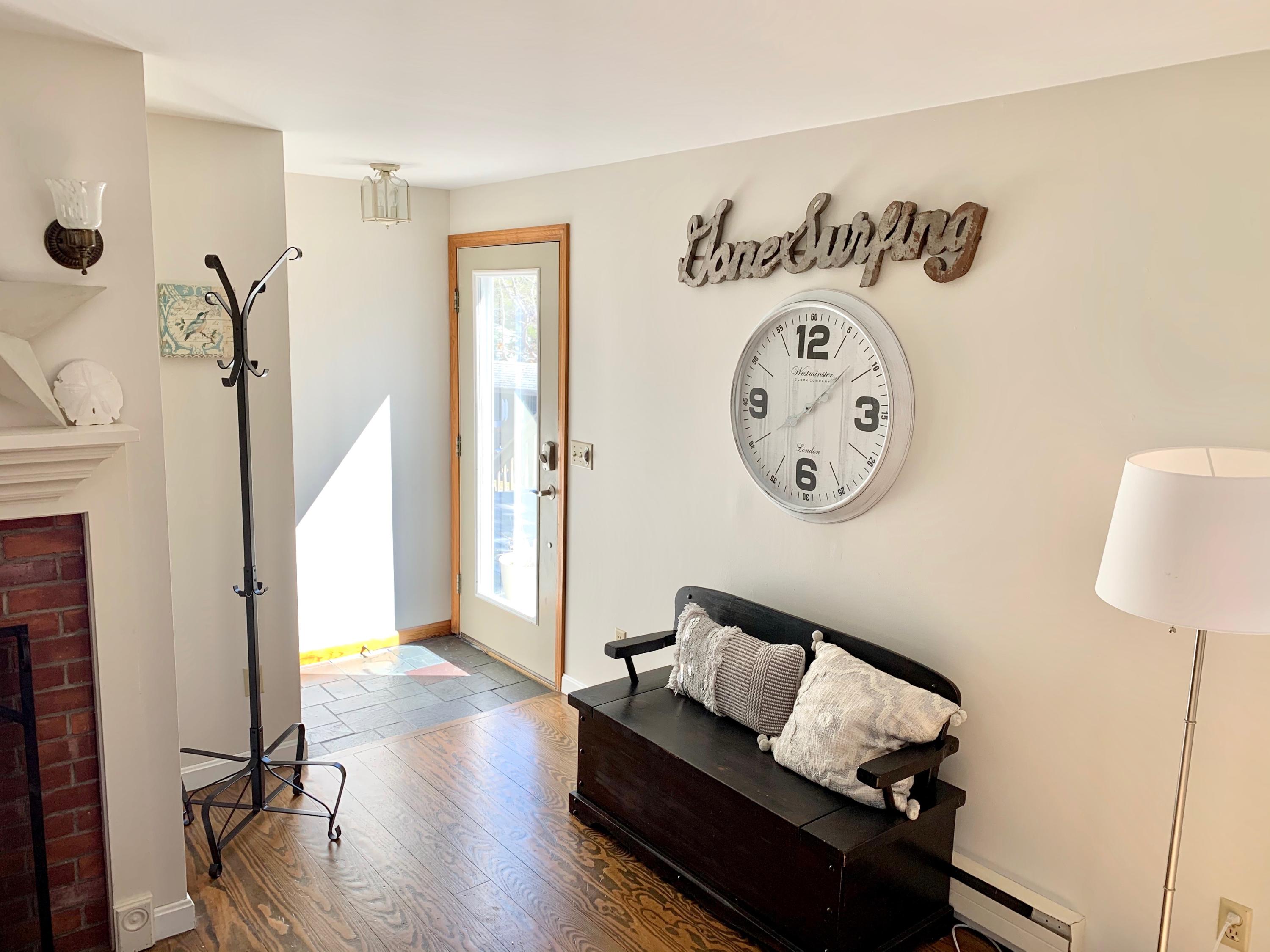 320 Cove View Road Wellfleet, MA 02667 - Photo 6 of 42 a living room with furniture and a wooden floor